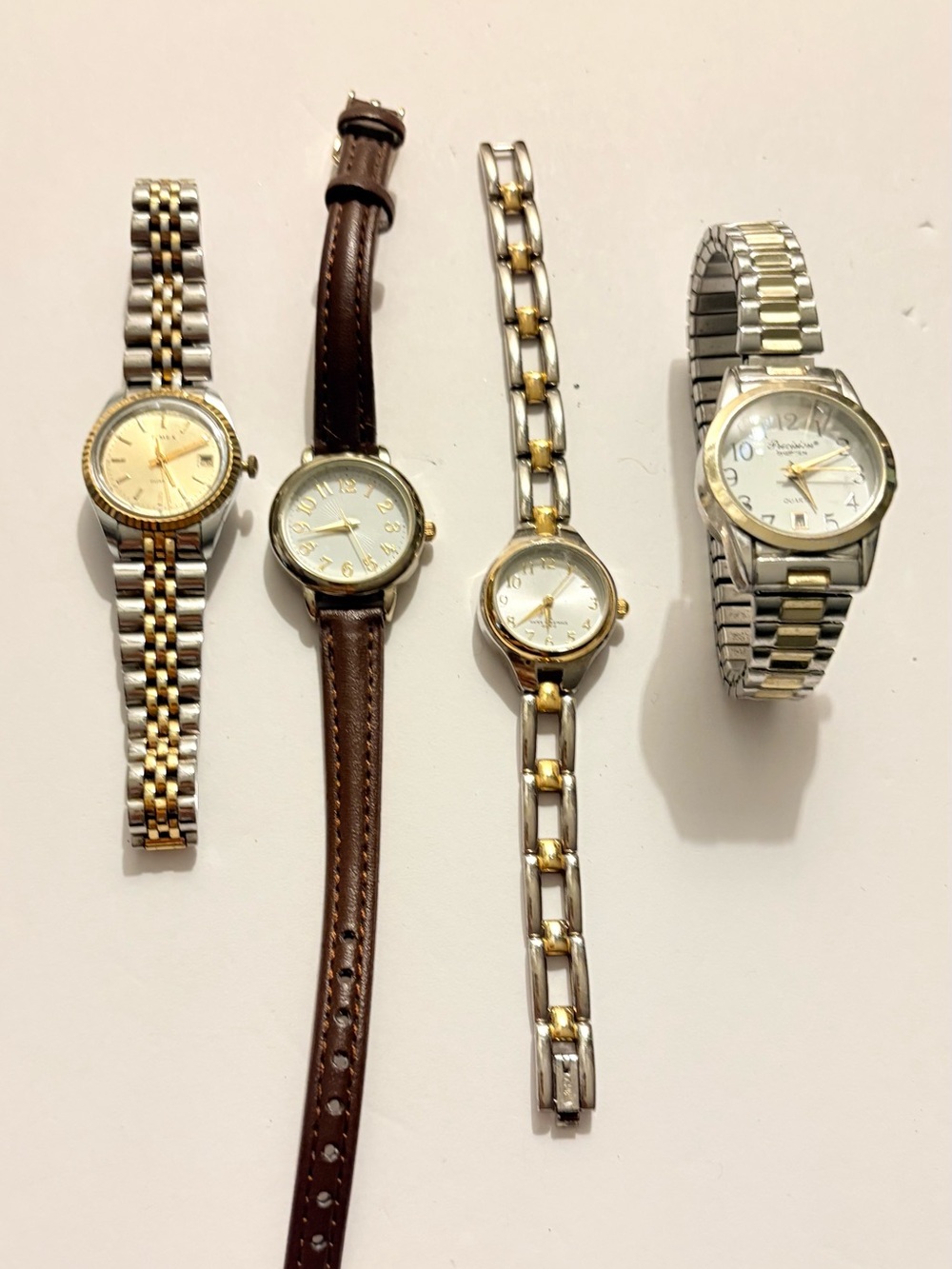 Bundle of 4 Timex Two-Tone Gold and Silver Watch Back Close-Up